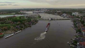 Ship sailing through drawbridge, aerial view video