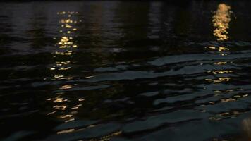 Close up view of river wave on moving boat at night, Amsterdam, Netherlands video