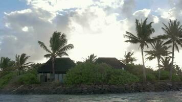 Houses in tropics, view from sailing boat video