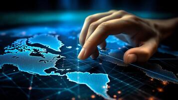 a hand touching a digital interface with a world map in the background photo