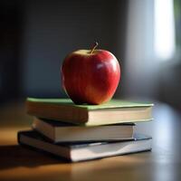 a stack of books with an apple on top of them photo