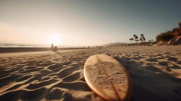 a surfboard on sand at the beach photo