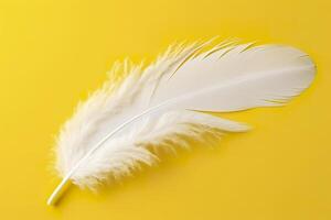 Close up of bright white feather. Copy space, yellow background. Fashion and Party concept. AI Generative photo