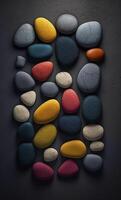 Some colorful stones are displayed, dark navy and yellow, photo