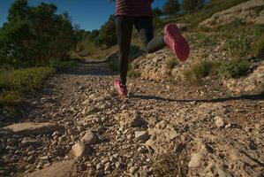 Woman runs through the mountains of Montserrat in Catalonia, Spain. photo