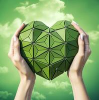 A female hand shows a heart shape on a green background with a cross in it, medical stock images photo