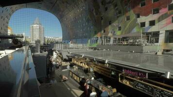 People shopping for food in Market Hall, Rotterdam video