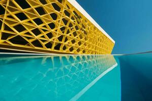 Modern yellow building with pool. Generate Ai photo