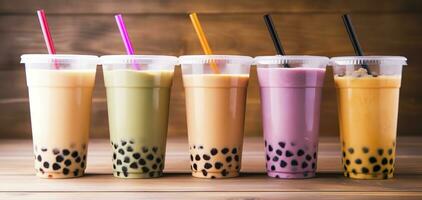 Plastic cups of different tasty bubble tea on wooden background. Generative AI photo