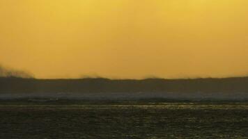 Ocean view with crushing waves at sunset video