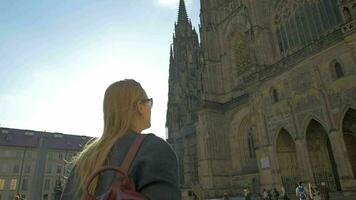 Woman tourist and St Vitus Cathedral in Prague video