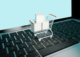 Shopping cart with laptop business concept photo