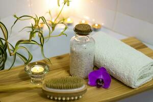 Spa-beauty salon, wellness center. Spa treatment aromatherapy for a woman's body in the bathroom with candles, oils and salt. photo