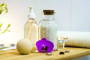 Spa-beauty salon, wellness center. Spa treatment aromatherapy for a woman's body in the bathroom with candles, oils and salt. photo