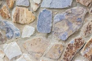 The walls are made of natural stone. background, texture. Close-up background. photo