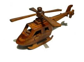 Wooden helicopter toy in white isolated background photo