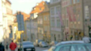 Slow motion view of unfocused cityscape on the background and then seen ice cream balls in the waffle cup, Prague, Czech Republic video