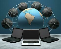 A blackboard and five laptops sitting next to a globe, international internet day stock photos