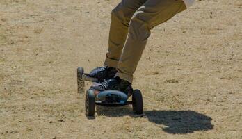 Longboarding mountain skate downhill with motion, adventure sports or extreme sports are activities perceived as involving a high degree of risk. photo