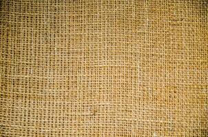 Brown texture of sack in close up, made of strong cloth. photo