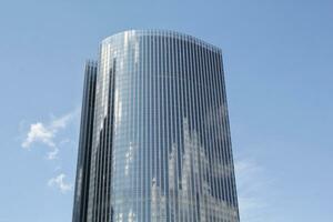 Walls and facades of Moscow City International Center on blue sky background. Bottom up view. Modern skyscrapers. Business district in Moscow, Russia. Office rental and real estate Moskva City photo