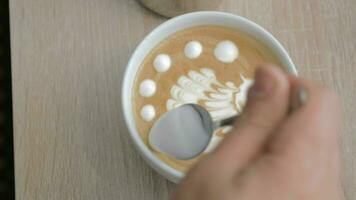 close up shot of barista finishing cream picture on latte matcha video