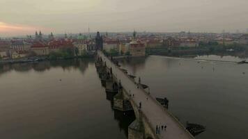 Ancient Charles Bridge and Prague view, aerial shot video