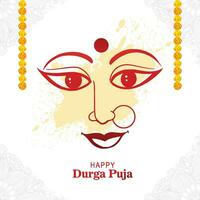 Goddess durga face in happy durga puja card background vector