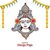 Goddess durga face in happy durga puja card background vector