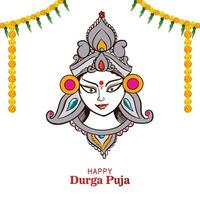 Goddess durga face in happy durga puja card background vector