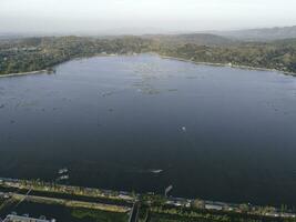 Aerial drone view of Rowo Jombro Lake with a lot of fish pond in Klaten, Indonesia photo