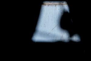 Light passing through a hole in the roof The impact on the wall creates various shadowy images. Used as a background for the composition. photo