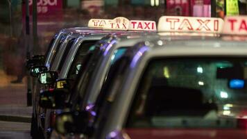Timelapse of taxi cars waiting for clients in night Hong Kong video