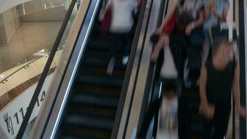 Timelapse of escalators with people in trade centre video