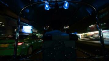 Timelapse of driving tuktuk in night Bangkok, Thailand video