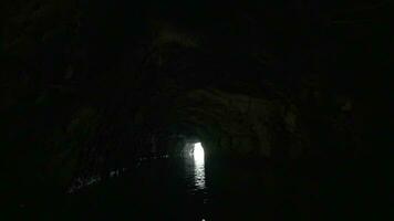 Boat traveling through the limestone cave in Ha Long Bay, Vietnam video