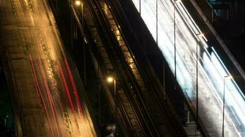 Timelapse of transport trails and empty railway in night city video