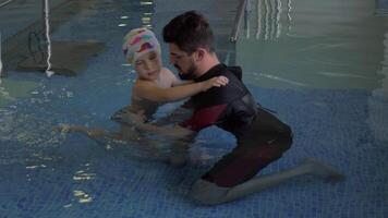 Child undergoing therapy in water video