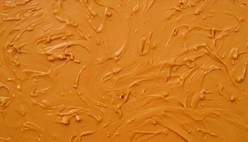 Delicious melted caramel texture. Flow, wave and drops splash caramels sauce. Sweet food design background. photo