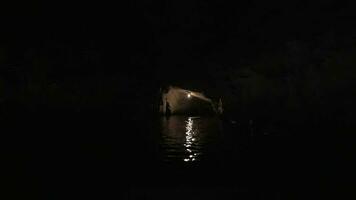 Sailing in dark karst cave of Ha Long Bay, Vietnam video