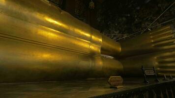 Seen a large golden statue of the reclining Buddha video