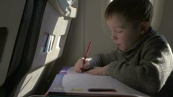 Child drawing during the flight video