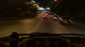 Timelapse of car driving in night city, inside view video