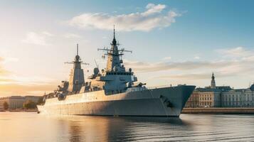 A large warship stands in the port of a European city photo