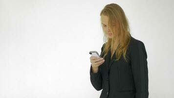 In studio a young girl working on a mobile phone video