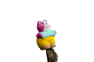 Small teddy bear on a tree in pastel colors of blue, pink, yellow. on transparent background png