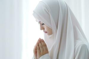 Hijab woman praying with hands together in the room, muslim concept AI Generated photo