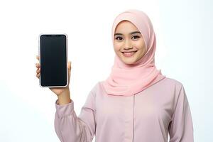 Hijab woman showing blank screen smartphone isolated on white background AI Generated photo