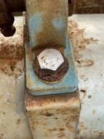 old rusty metal plate on machine photo