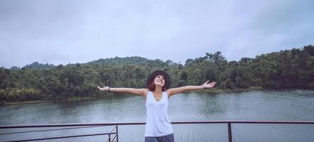 Asian women relax in the holiday. In the natural atmosphere, mountain forest. photo